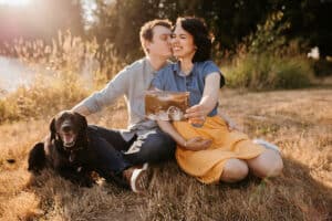couples shoot with dog pregnancy announcement
